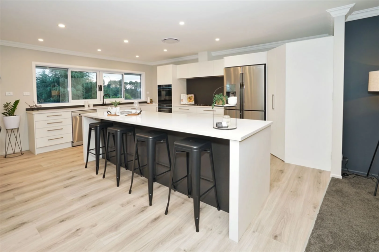 Modern kitchen in Melmine and stone benchtops with corner pantry